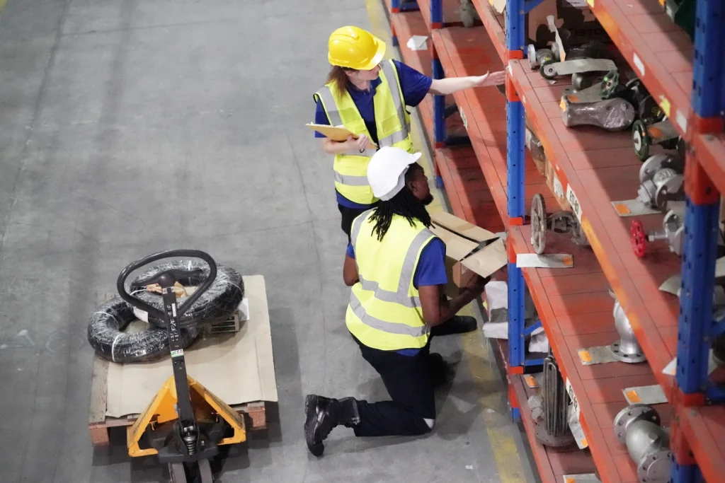 Employees preparing kitting materials